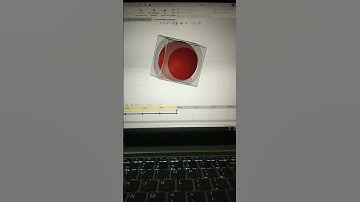 A trapped sphere in a cube Solid works 3D modelling