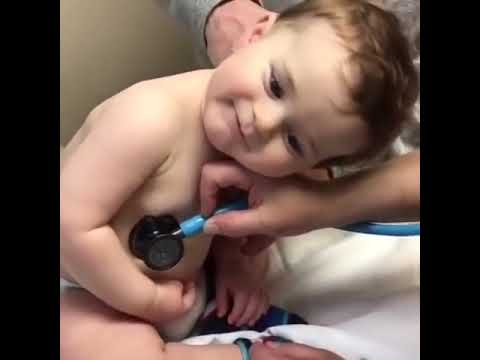 Sweet Baby Boy Rests Head On Nurses Hand