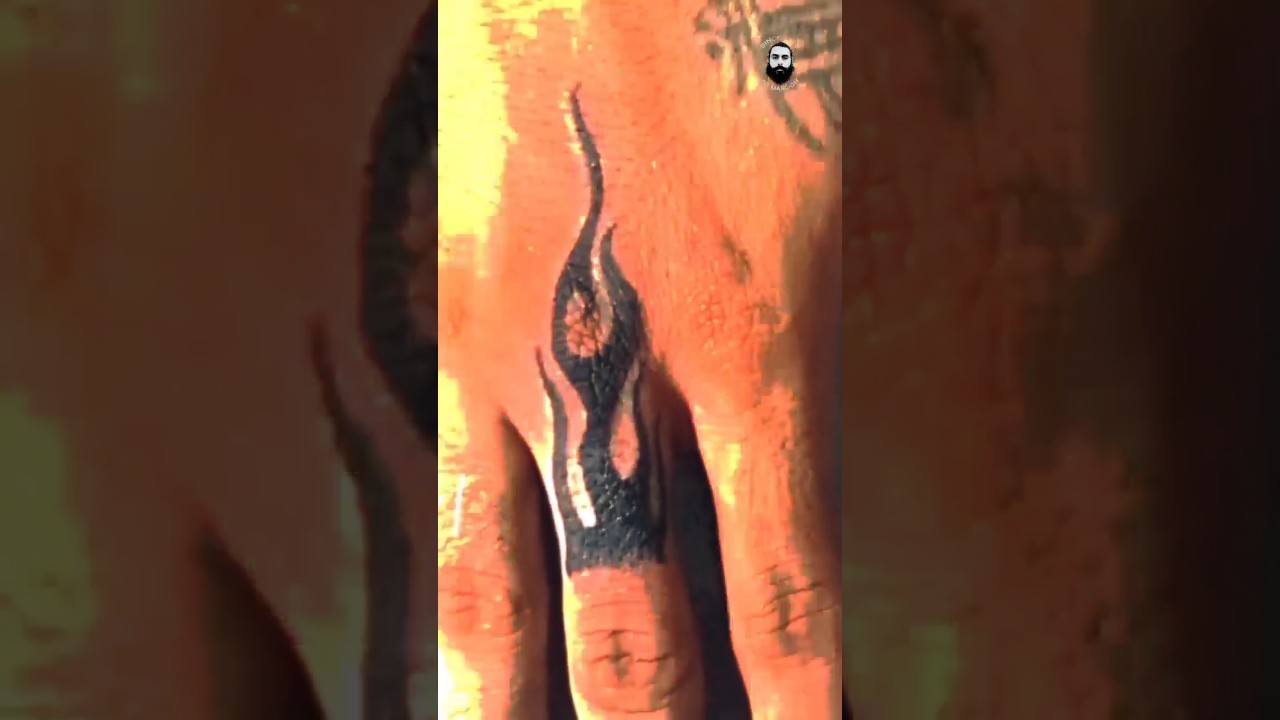 Fire tattoo on finger 