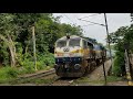 Bengaluru-Talguppa InterCity Express, train # 20651 speeds past a level-crossing