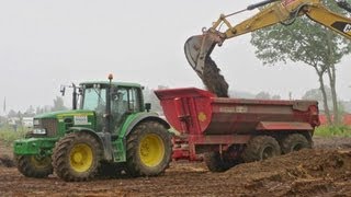 JOHN DEERE TRACTOR WITH DUMP TRAILER LOADING SAND CATERPILLAR 323E