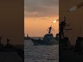 Photorealistic cinematic footage of a large-scale naval battle in the open ocean. Multiple