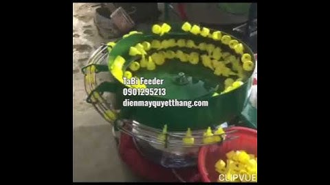 máy cấp nắp tương ớt. phễu rung cấp phôi.