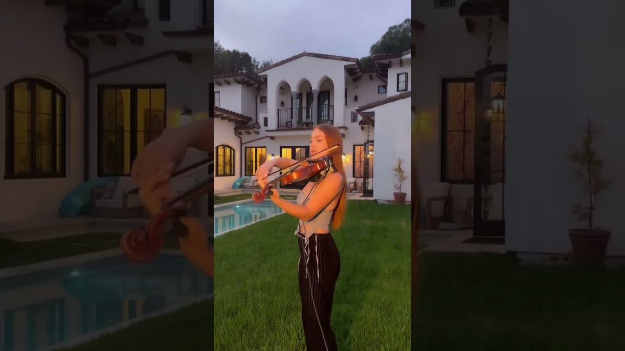 Katie performing Can't Help Falling In Love on violin