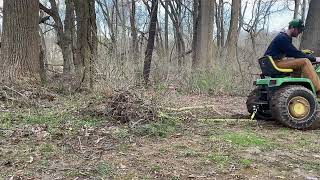 John Deere 430 pulling small brush with Brush Grubber