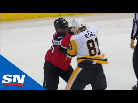 Phil Kessel and Brett Seney Drop The Gloves During A Potential Scoring Chance For The Devils