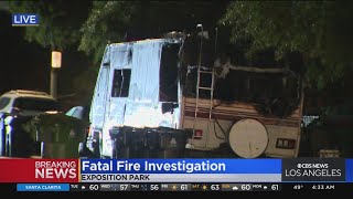 Man found dead in burned RV in Exposition Park; homicide suspect sought