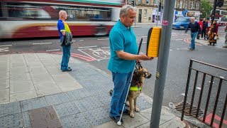 How someone who is blind or partially sighted crosses the road