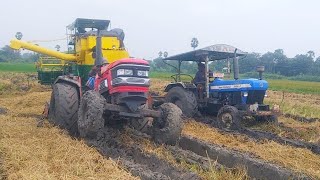 John deere harvester stuck in deep mud pulling mahindra arjun tractor, new holland tractor failed