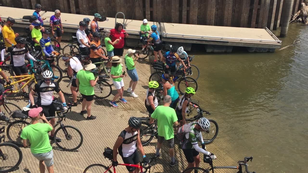 Watch Now RAGBRAI cyclists dip their tires in the Mississippi River to