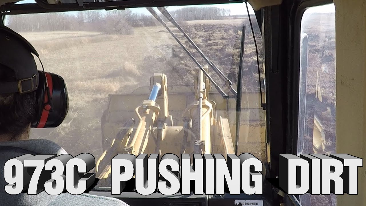 CAT 973C Track Loader Pushing Dirt In Slough - YouTube