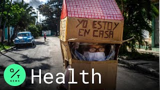 Coronavirus: Grandma Wears Cardboard Suit As Covid-19 Protection