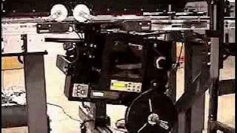 Label Printer Applicator applies label to the bottom of small boxes