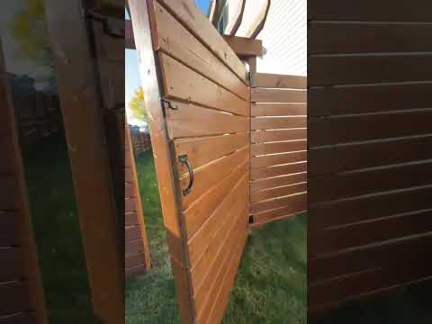 Video walkthrough of the stained fence and gate in Springbank Hill, Calgary