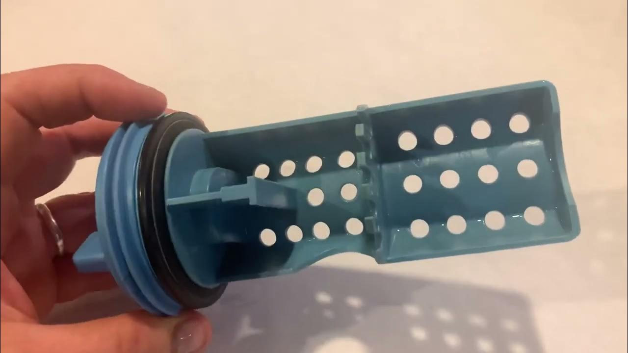 Inspecting the pump filter from a GE UltraFresh washing machine/ rubber