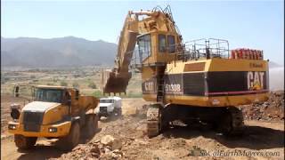 CATERPILLAR 5130B Excavator loading Articulated Dump Trucks