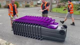 How were the new purple-lidded recycling bins delivered?