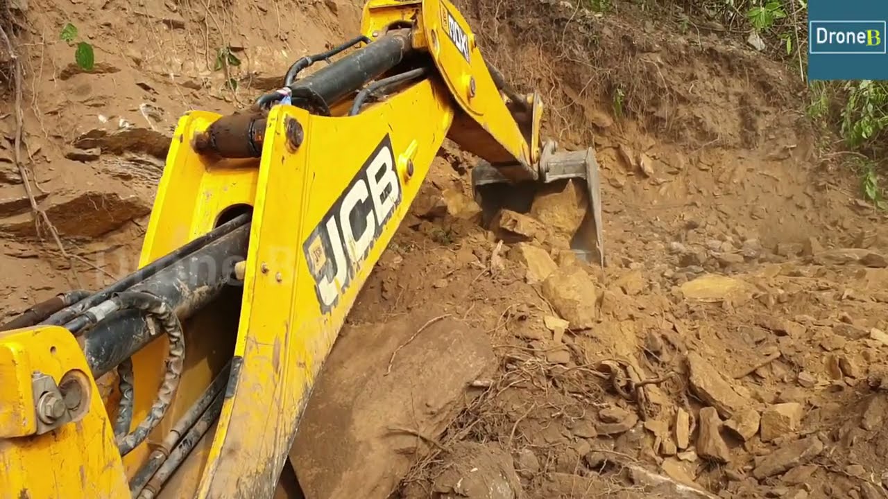 No Easy Job-Backhoe Loader-Stony New Road-Hilly Road Construction