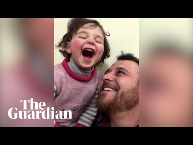 Syrian father teaches daughter to cope with bombs through laughter class=