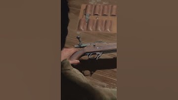 Joel adding a scope to a rifle