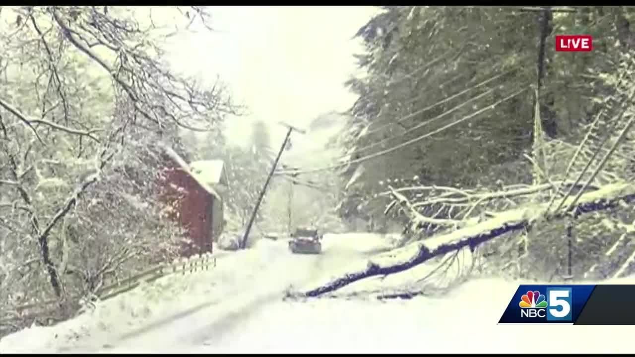Heavy, wet snow covers road, causes power outages - YouTube