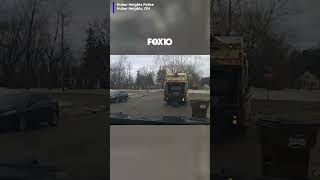 WATCH: Dashcam video captures the moment a sanitation worker finds a fugitive hiding in a trash can.