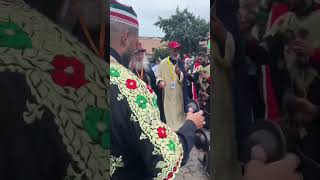 The procession of Storytellers and Moroccan musicians to Jemaa El-Fna square in Marrakesh