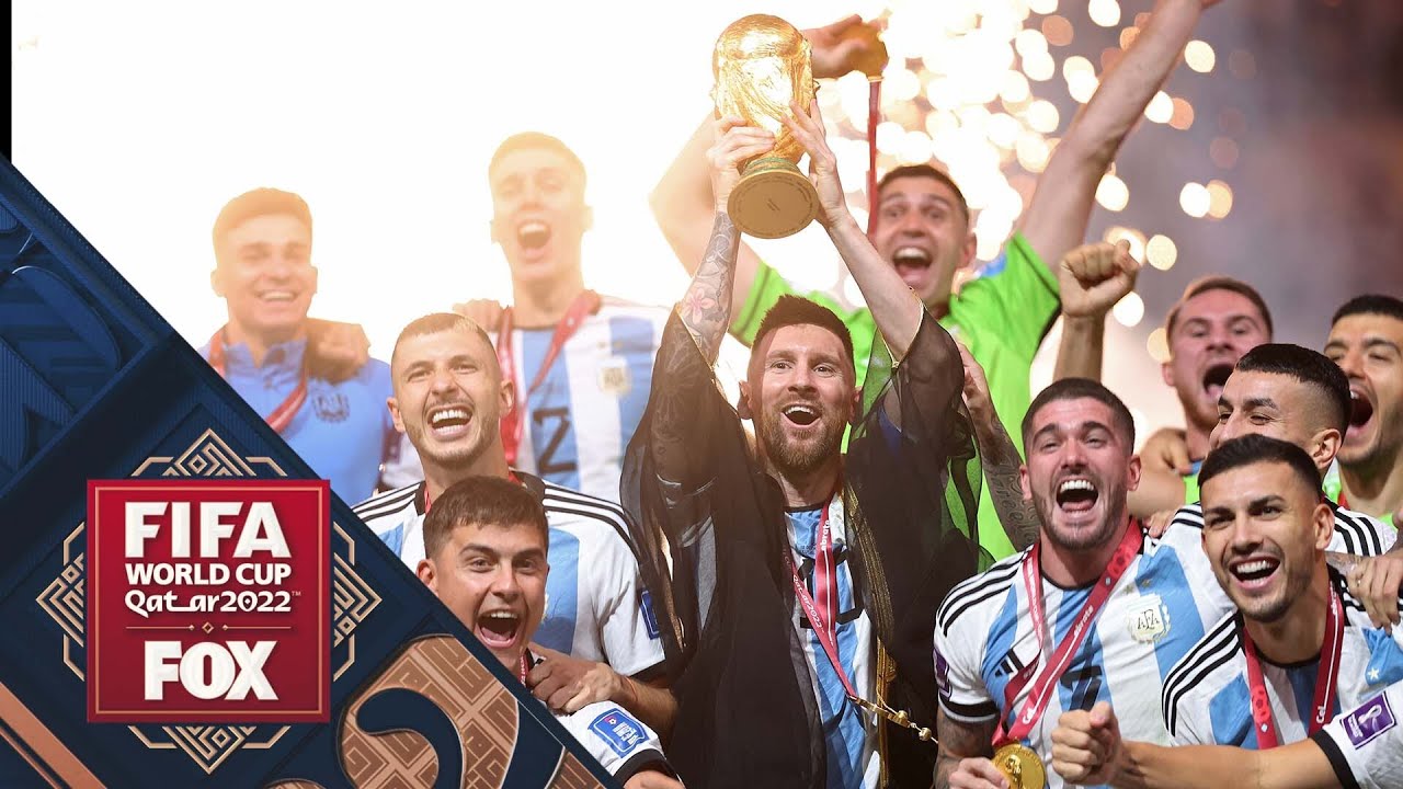 Lionel Messi hoists trophy after Argentina wins the 2022 FIFA World Cup FOX Soccer