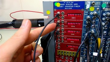 Cosmic Ray detection with a NIM crate and photomultipliers.