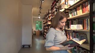Free Footage  Woman reading book in library