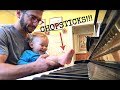 Dad plays the piano beautifully with a pair of little baby feet