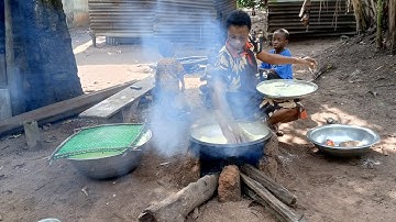 African village life , Frying garri