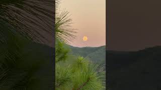 The sun sets and the moon rise