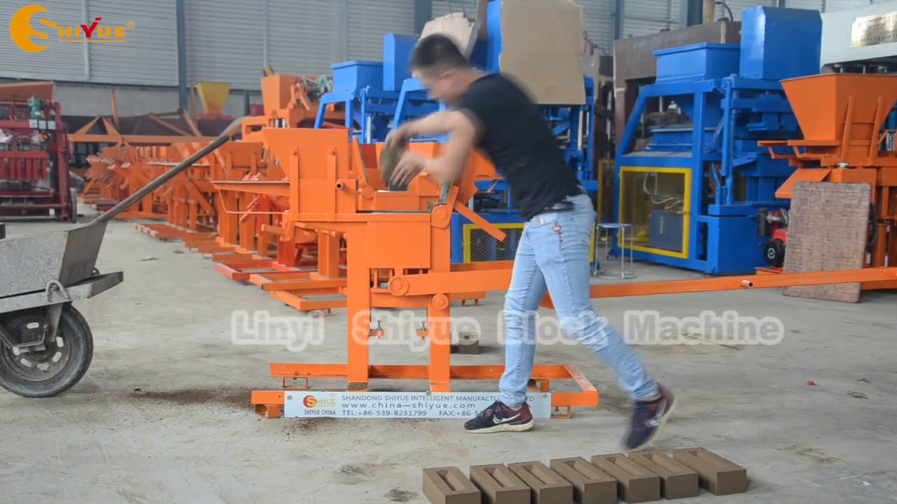 QMR2-40 manual clay interlocking brick making machine - YouTube