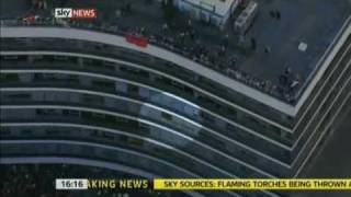 Throwing fire extinguisher on to riot police and smashing Millbank Tower windows - Demo 2010
