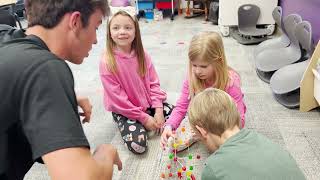 High School Students Volunteer with 1st Graders