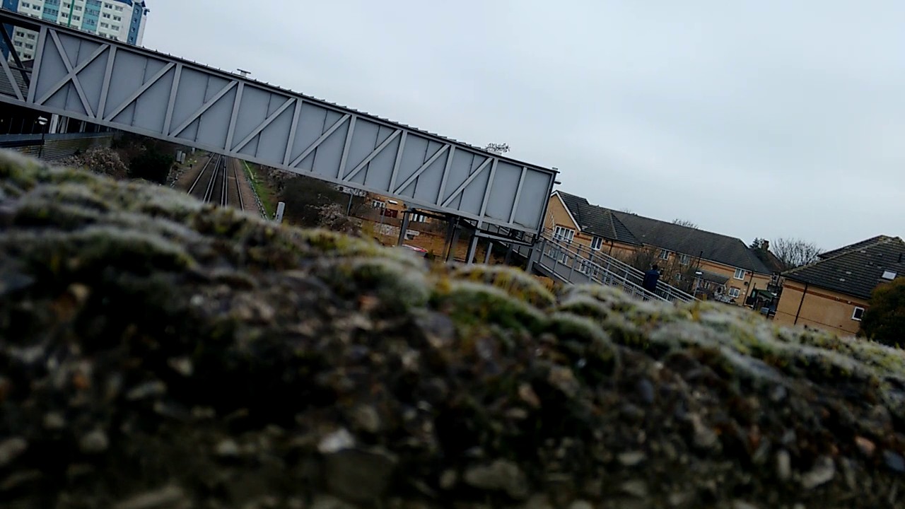 Intro and closure in slow motion Feltham station level crossing Grater London