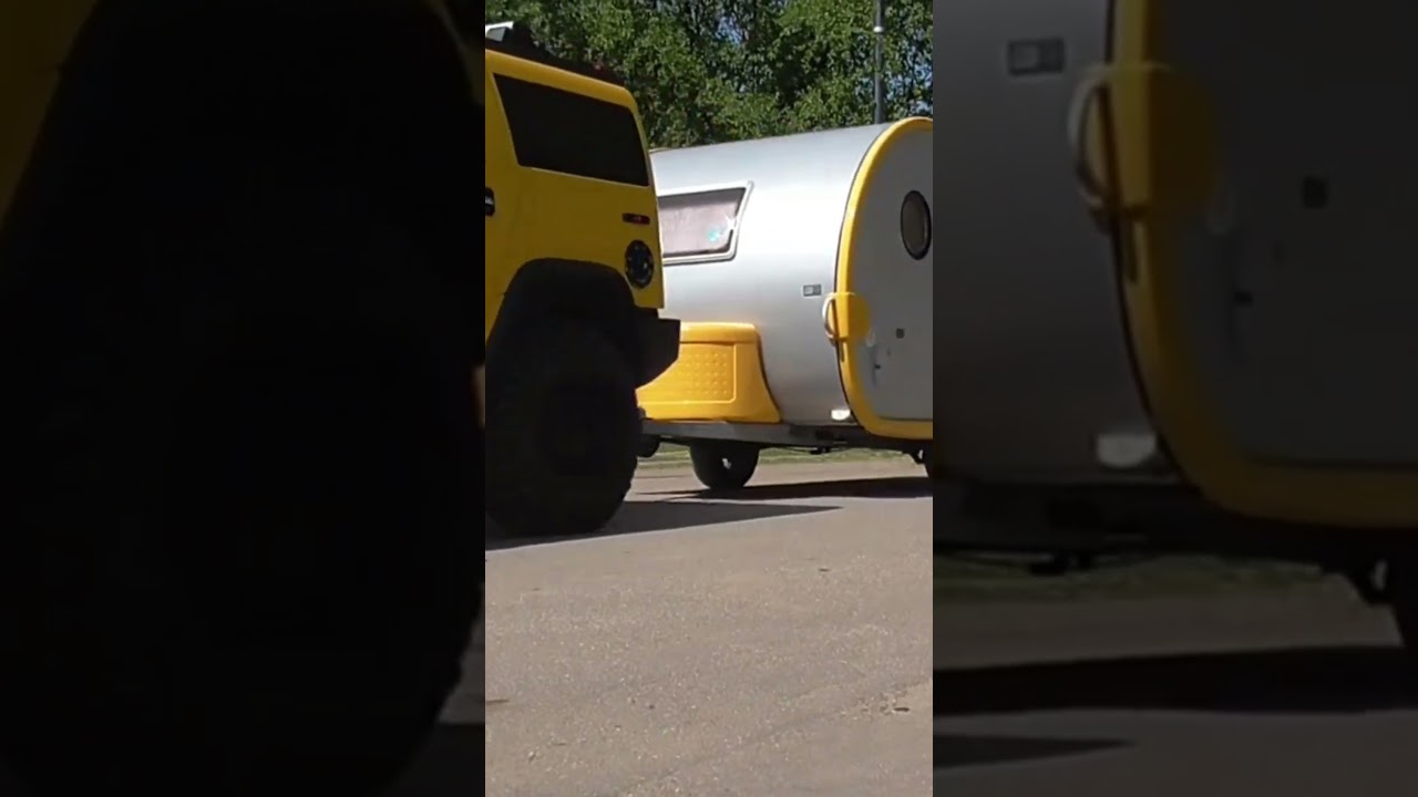 YellowHummer pulling caravan
