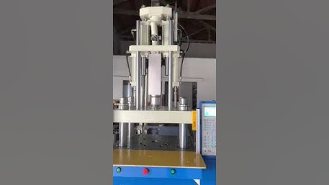 Vertical injection molding machine in stock before delivery loading and trials running