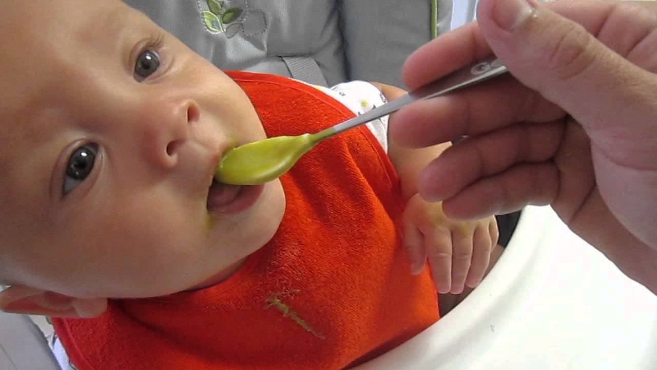 Baby eats food for first time - YouTube