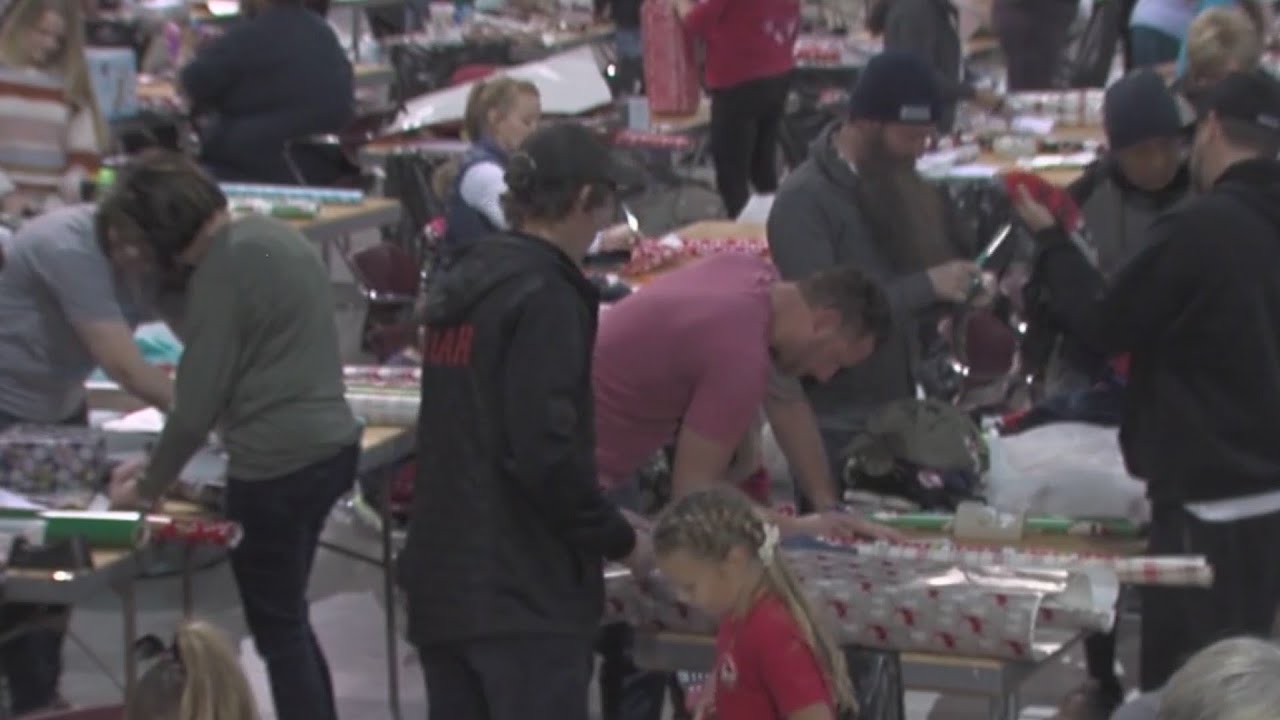 Volunteers elves wrap thousands of gifts for Washington County children