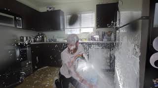 Guy spills 'milk' all over his kitchen