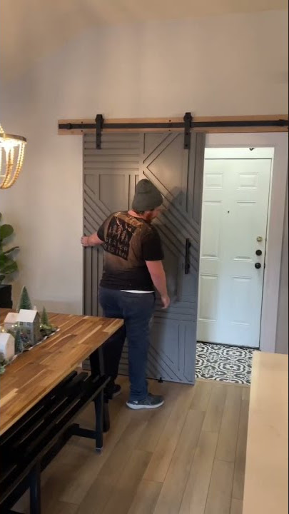 Modern style sliding barn door with a geometric design