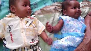 4 month old Twin babies playing with grand parents