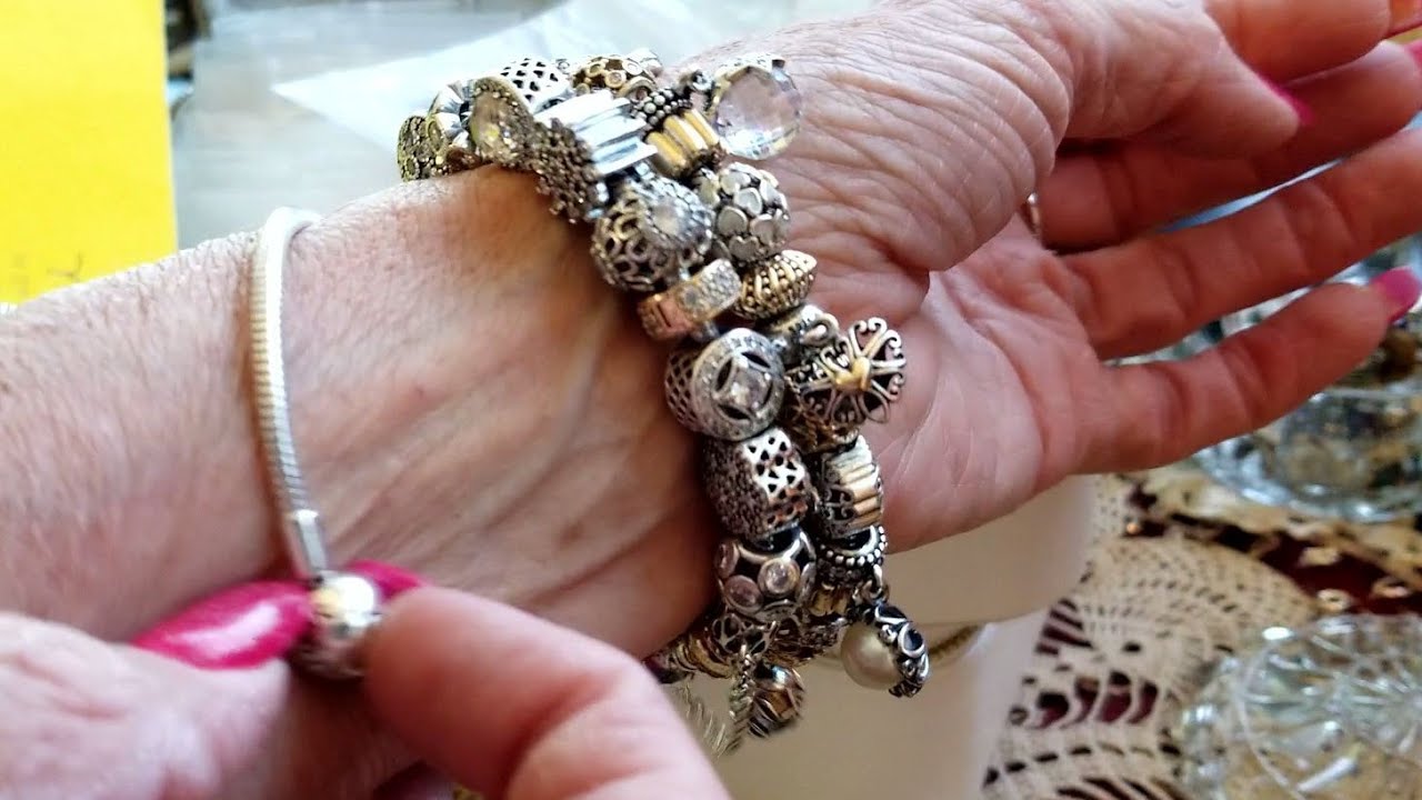 Pandora Bracelet With Gold, Black, and Silver Charms 