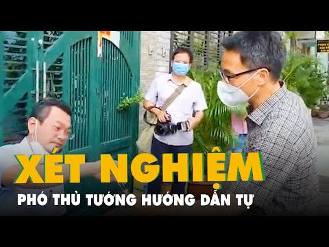 Phó thủ tướng Vũ Đức Đam hướng dẫn lãnh đạo quận 7 tự test nhanh COVID-19 tại chỗ