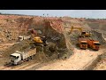 Extremely Machines Dirt Loading Into Dump Trucks Operating With Volvo Komatsu Hitachi Excavator