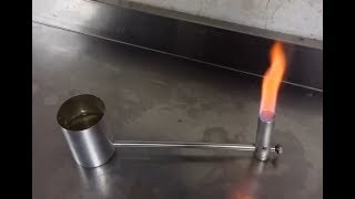 Alcohol burner with remote feeding