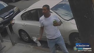 Man arrested for throwing water on queens police