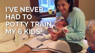 Pottying a newborn baby boy over a pad